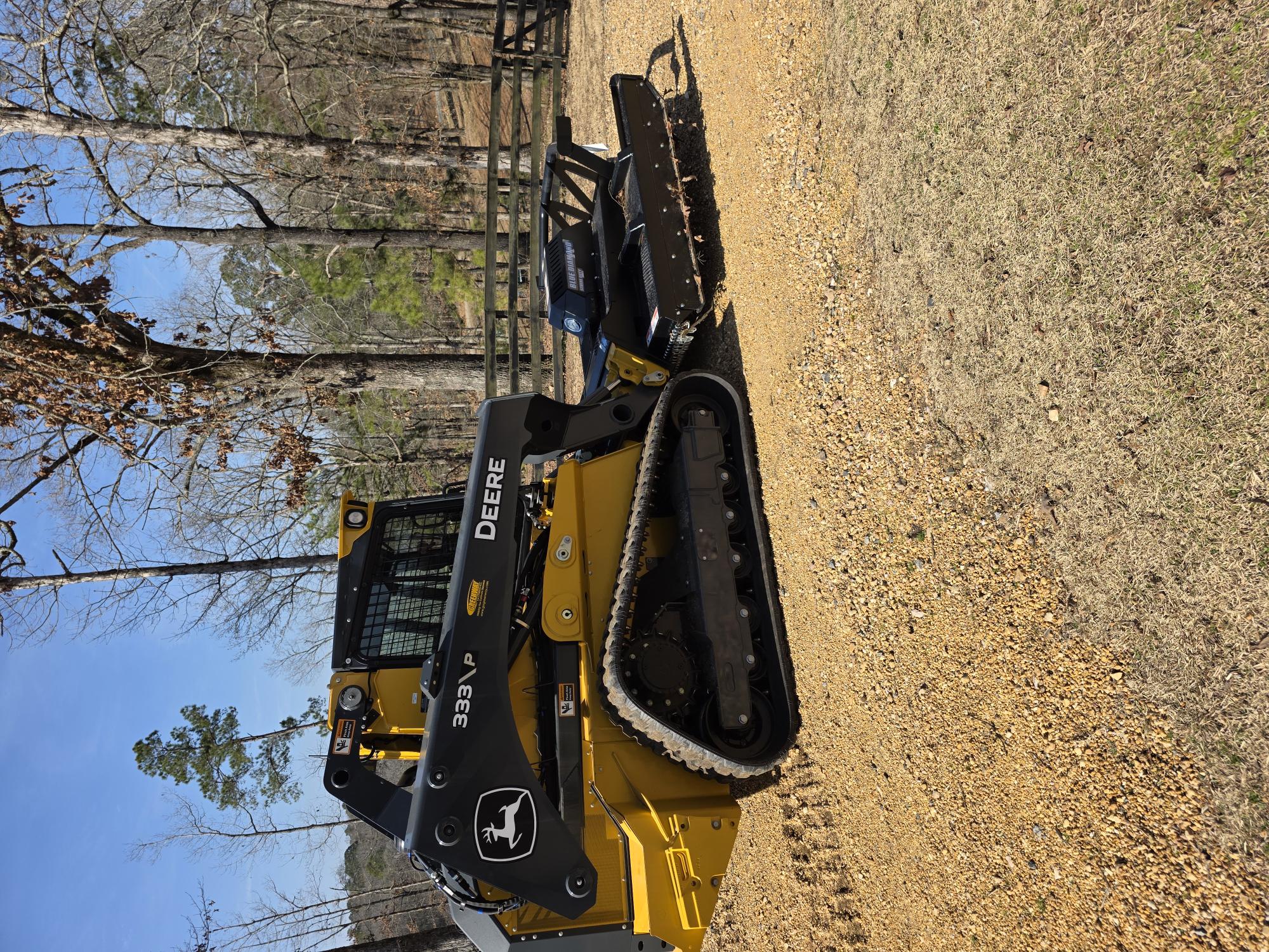 John Deere 333P with Blue Diamond brush cutter attachment